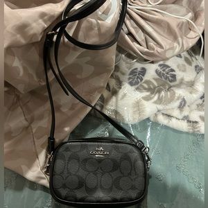 Unused COACH purse, black and grey with coach symbols. Small